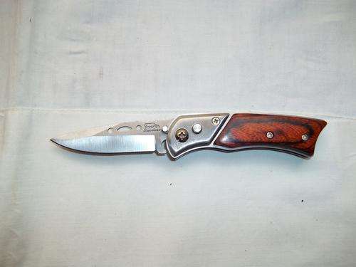 Flick knife with wooden handle