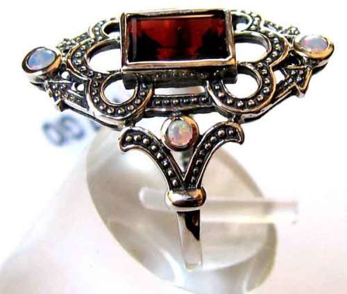 Genuine Opals and Garnet  in Sterling Silver Ring.