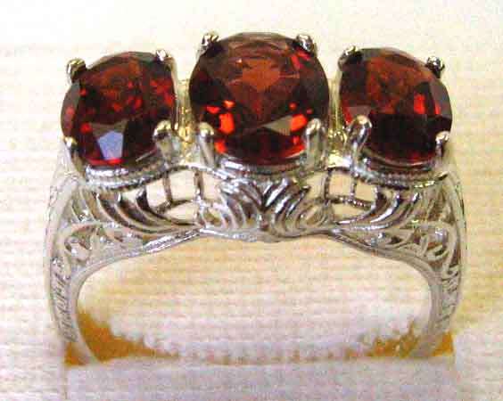 Lovely , Sterling Silver and Genuine Garnets Ring.