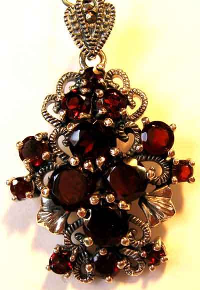 Pretty Sterling Silver, Marcasite and Garnets Pendant.