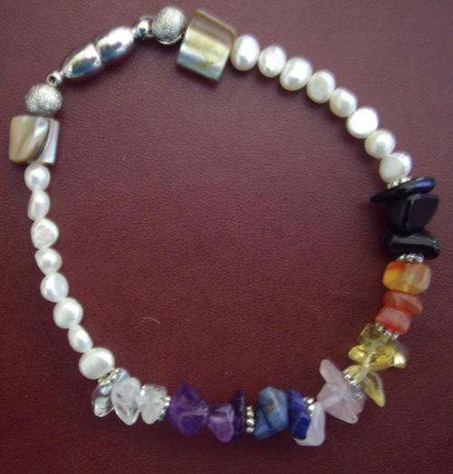 Gorgeous chakra balancing bracelet, with gems, pearls, shells - for the Goddess within you!
