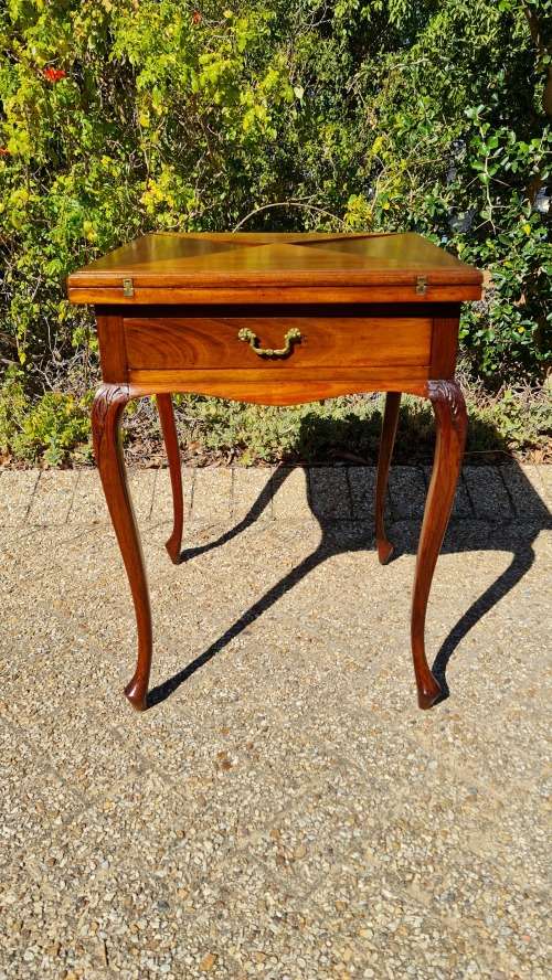 Mahogany card table on Queen Ann style legs.