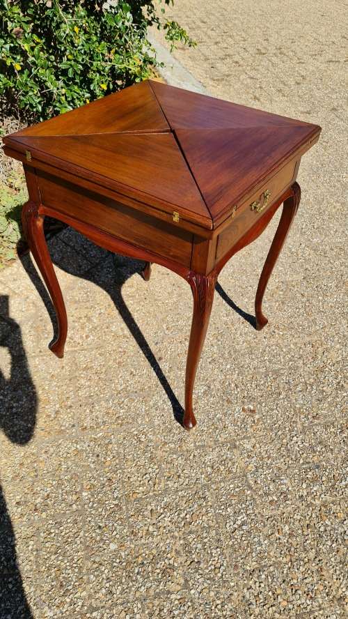 Mahogany card table on Queen Ann style legs.