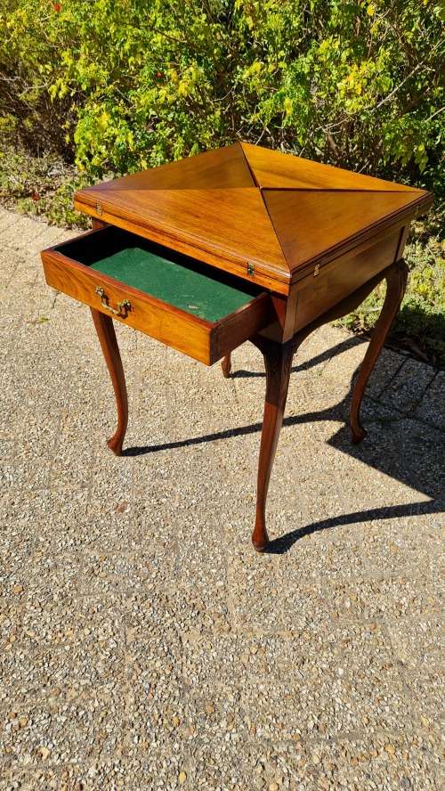 Mahogany card table on Queen Ann style legs.