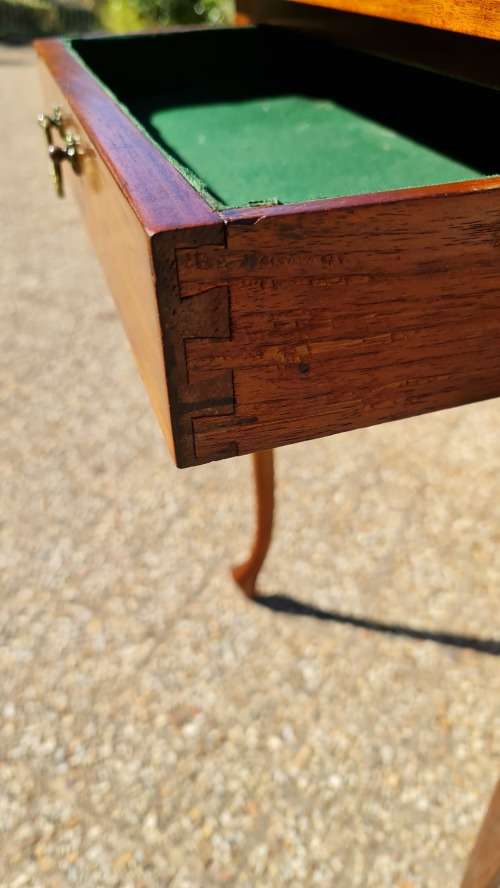 Mahogany card table on Queen Ann style legs.