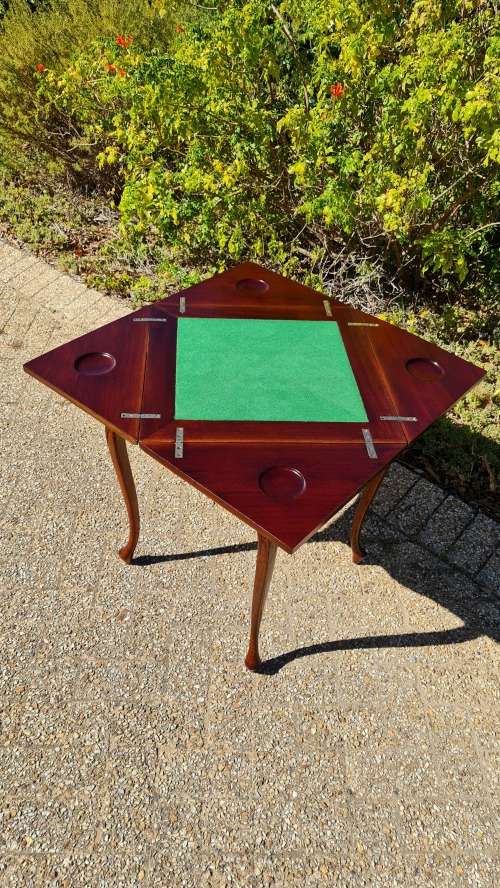 Mahogany card table on Queen Ann style legs.
