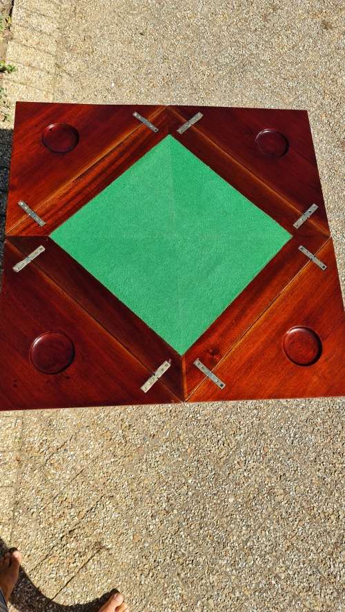 Mahogany card table on Queen Ann style legs.