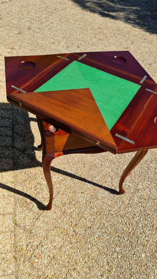 Mahogany card table on Queen Ann style legs.