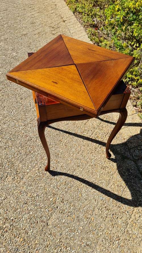 Mahogany card table on Queen Ann style legs.