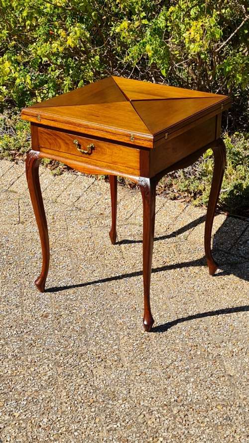 Mahogany card table on Queen Ann style legs.