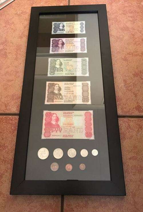 Framed collection of notes and coins