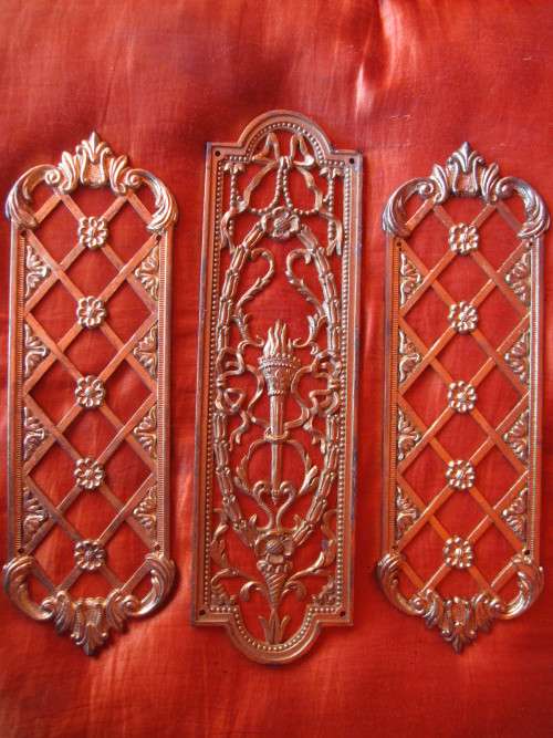 THREE DECORATIVE ORMOLU METAL DOOR PLATES