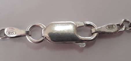 A sterling silver neck chain with sterling silver and marcasite pendant.  Wow!!!