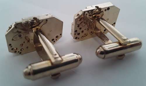 Pair gold-plated `Excello Watch Co` clock movement cufflinks.