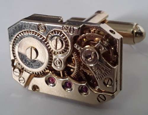 Pair gold-plated `Excello Watch Co` clock movement cufflinks.