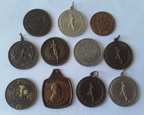 Collection of various vintage running medals.  1 bid takes all!