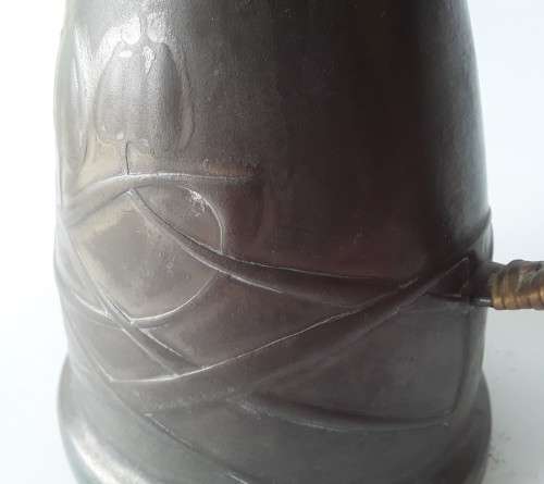 Antique Arts and Crafts pewter jug in the style of Liberty and Co. Hand-beaten lily pattern.