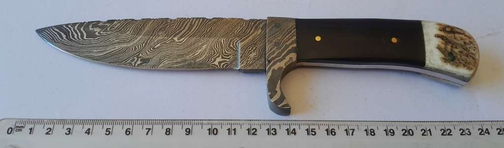 A Superb Damascus Blade Hunting Knife With Leather Sheath And Display Stand.