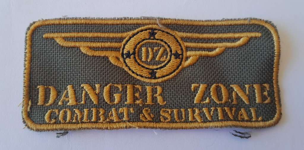 Large `Danger Zone Combat & Survival` Badge.