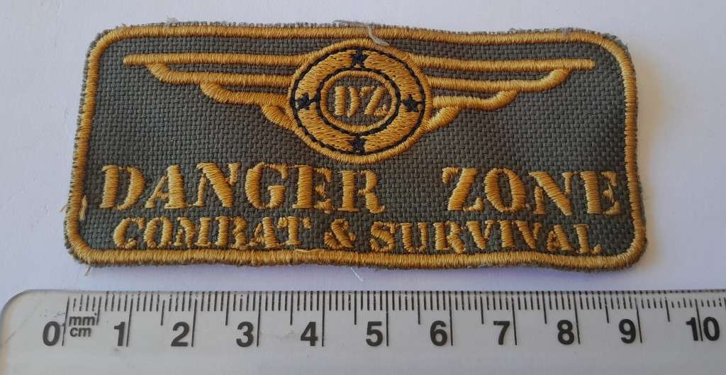 Large `Danger Zone Combat & Survival` Badge.