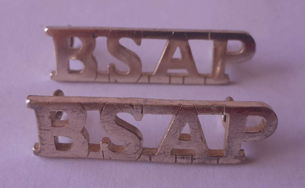 Pair Rhodesia BSAP (British South African Police) Shoulder Titles. Lugs intact.