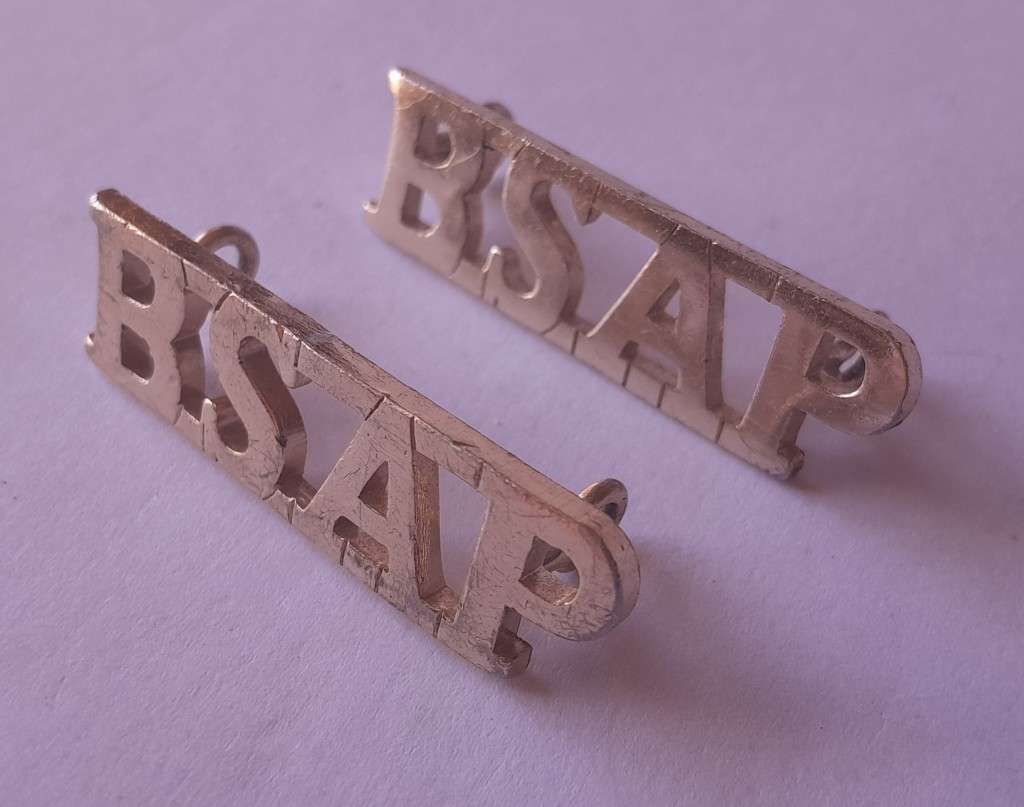 Pair Rhodesia BSAP (British South African Police) Shoulder Titles. Lugs intact.