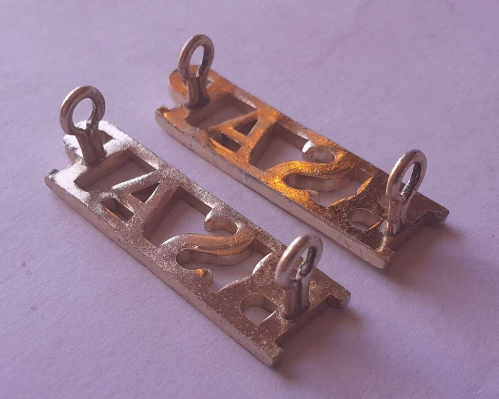 Pair Rhodesia BSAP (British South African Police) Shoulder Titles. Lugs intact.