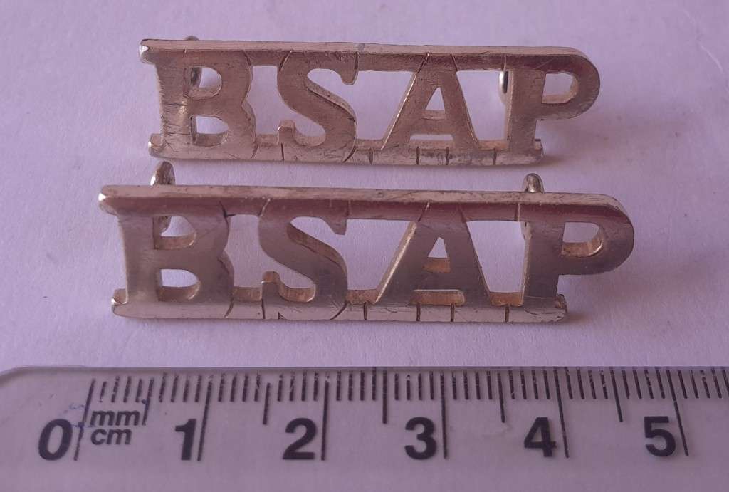 Pair Rhodesia BSAP (British South African Police) Shoulder Titles. Lugs intact.