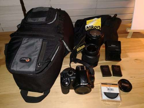 Nikon D3100 DSLR with 18-55mm & 55-200mm lenses and Lowepro bag