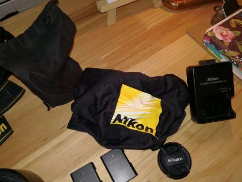 Nikon D3100 DSLR with 18-55mm & 55-200mm lenses and Lowepro bag