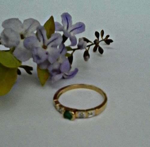 An exquisite 9kt gold Emerald and Diamond ring.