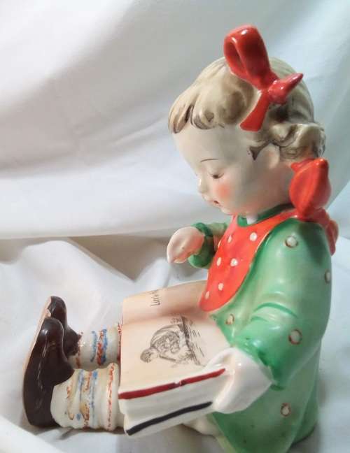 Two beautiful Hummel style little girls reading - Bookends