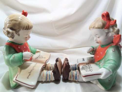 Two beautiful Hummel style little girls reading - Bookends