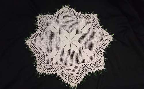 White Vintage crocheted jug cover with green glass beads