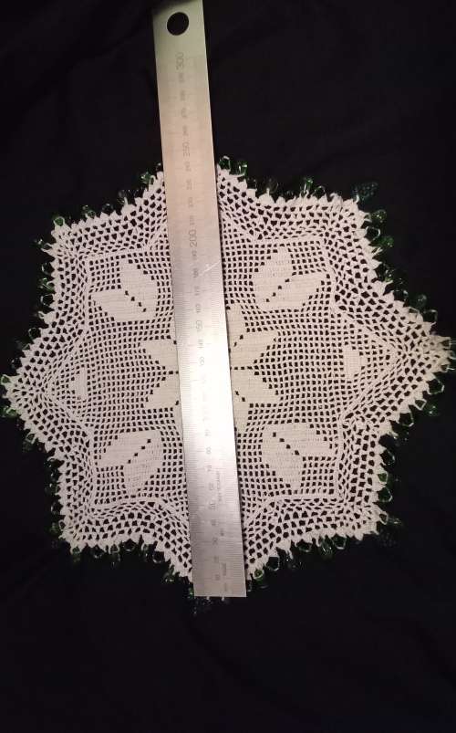 White Vintage crocheted jug cover with green glass beads