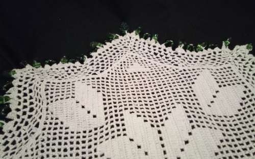 White Vintage crocheted jug cover with green glass beads