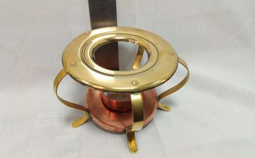 Brass and copper tea pot warmer
