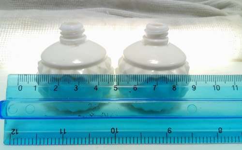 Two tiny Vintage milk glass bottles