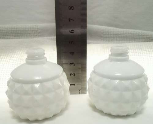 Two tiny Vintage milk glass bottles