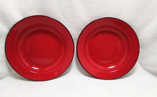 Two Vintage red enamel side plates