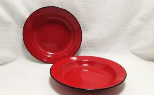 Two Vintage red enamel side plates