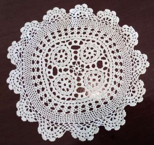 Beautiful crocheted doily - 27cms across