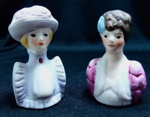 Two Avon thimbles