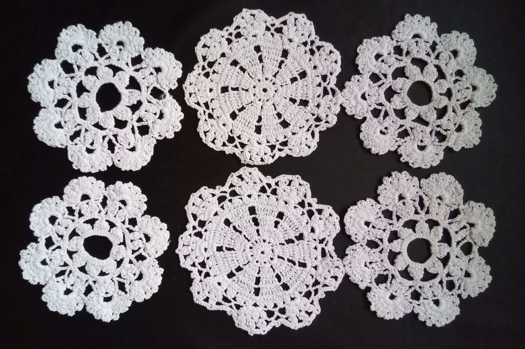 Six small tea cup Crocheted doilies - about 8cms across
