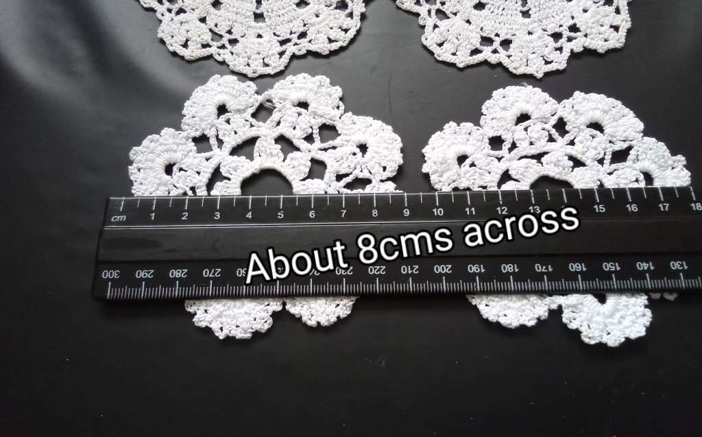 Six small tea cup Crocheted doilies - about 8cms across
