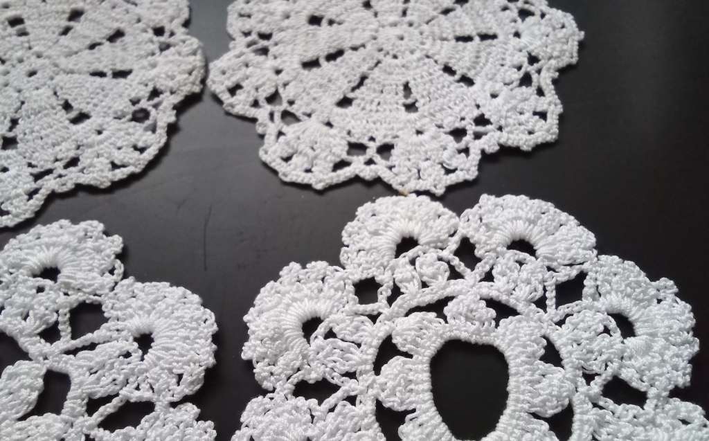 Six small tea cup Crocheted doilies - about 8cms across