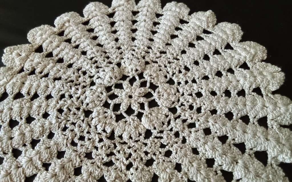 Beautiful beige crocheted doily - about 28cms across
