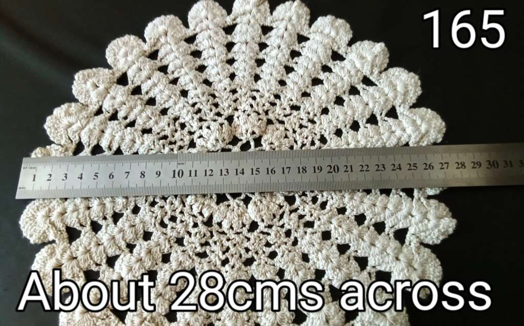 Beautiful beige crocheted doily - about 28cms across