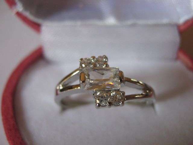 Size 9 - Unusual Baguette Cut centre stone Engagement Ring clad in 18K White Gold!!