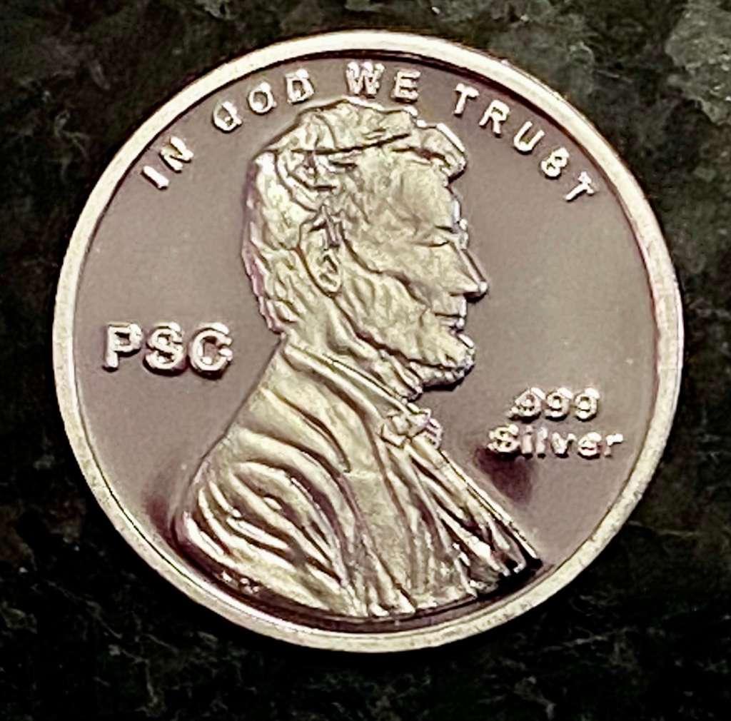 U S A -- SHIELD PENNY -- LINCOLN - IN GOD WE TRUST - 1/10 TROY OZ FINE SILVER - 99,99 SILVER ROUND